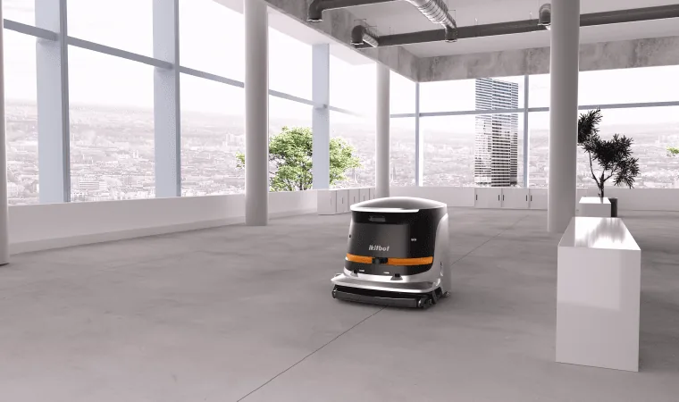 Robot de limpieza Amerevo ONE limpiando una planta de oficinas diáfana con grandes ventanales