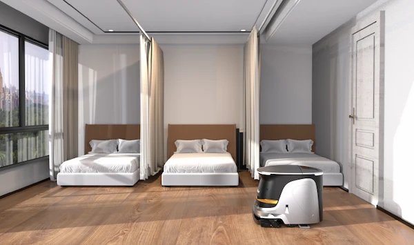 Robot de limpieza Amerevo ONE limpiando el suelo de una habitación de hotel